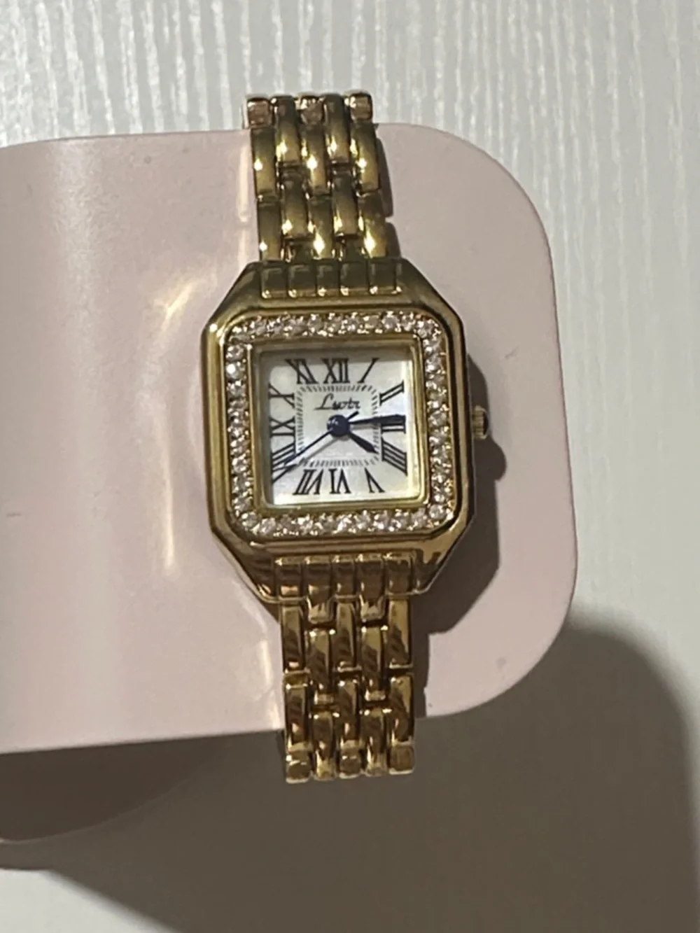 Elegant Gold-Tone Women's Crystal Bezel Watch with Blue Hands